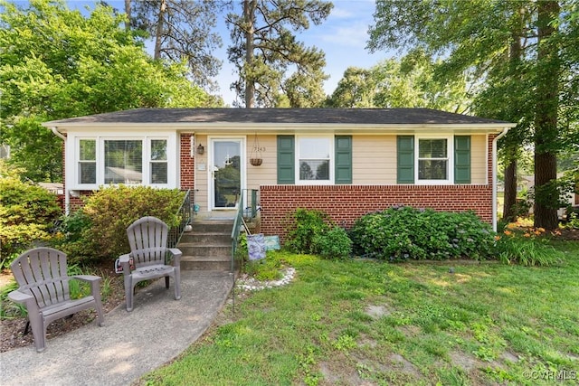 7143 Cherry Ln, Mechanicsville, VA 23111 - view of front of house featuring brick siding and a front yard