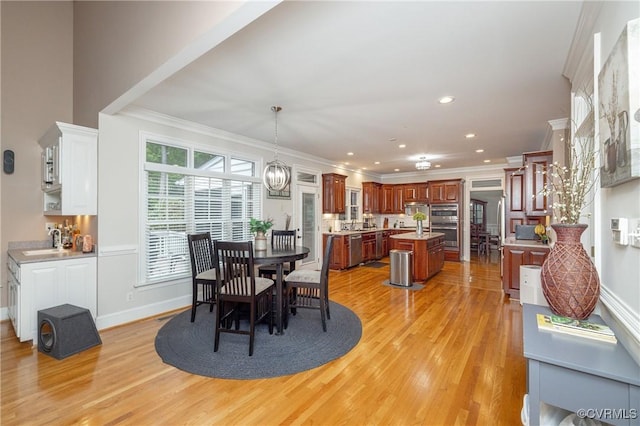 11407 Timber Point Dr, Chesterfield, VA 23838 - dining space featuring light wood-type flooring, crown molding, recessed lighting, baseboards, and a chandelier