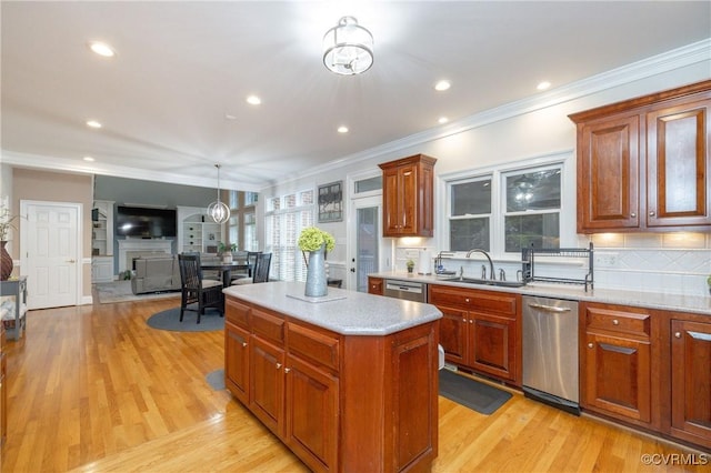 11407 Timber Point Dr, Chesterfield, VA 23838 - kitchen with a sink, crown molding, a center island, light wood-style flooring, and tasteful backsplash
