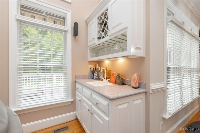 11407 Timber Point Dr, Chesterfield, VA 23838 - indoor wet bar featuring baseboards and light wood-style floors