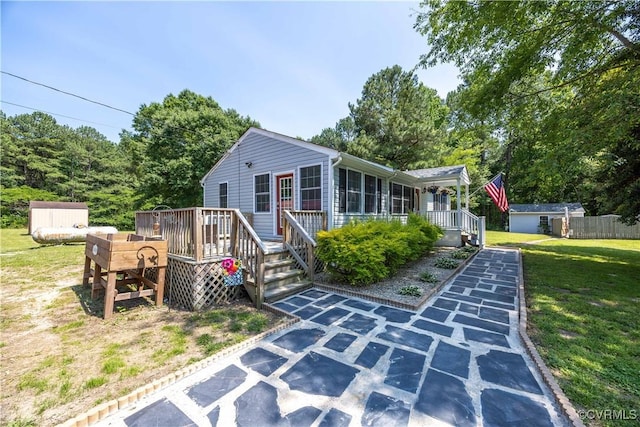 16701 Jolly Rd, Prince George, VA 23842 - view of front facade with a front yard and a wooden deck