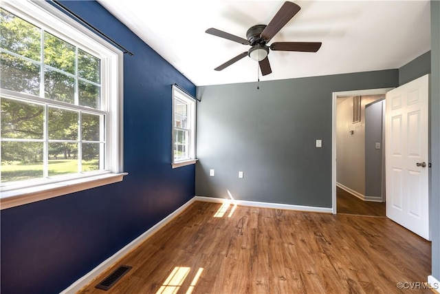 16701 Jolly Rd, Prince George, VA 23842 - spare room with baseboards, wood finished floors, and a ceiling fan