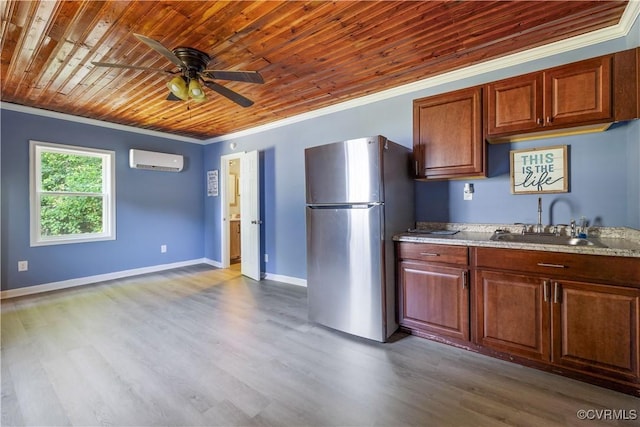 16701 Jolly Rd, Prince George, VA 23842 - kitchen featuring freestanding refrigerator, an AC wall unit, a sink, ornamental molding, and a ceiling fan
