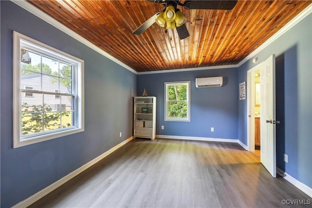 16701 Jolly Rd, Prince George, VA 23842 - empty room featuring ornamental molding, a wall unit AC, wood finished floors, wooden ceiling, and baseboards