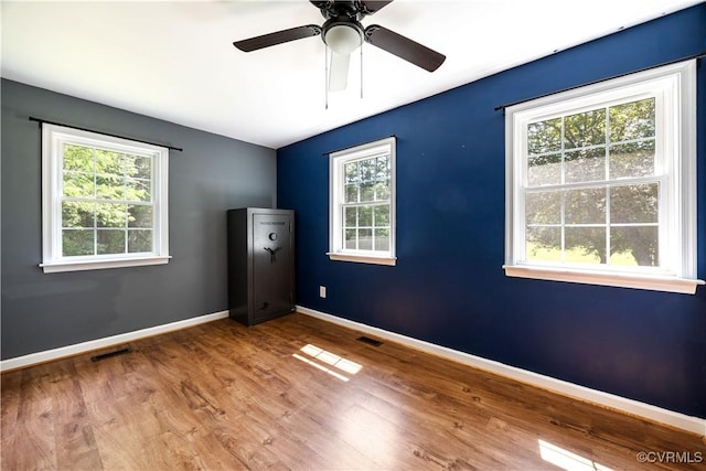 16701 Jolly Rd, Prince George, VA 23842 - unfurnished room with wood finished floors, baseboards, and ceiling fan