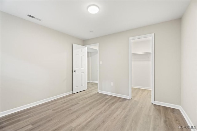 12 Wheelhouse Ct, Petersburg, VA 23805 - unfurnished bedroom with wood finished floors, a spacious closet, and a closet