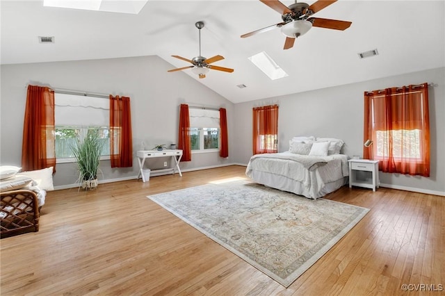 12912 Cottage Mill Pl, Midlothian, VA 23114 - bedroom with a skylight, vaulted ceiling, light wood finished floors, baseboards, and a ceiling fan