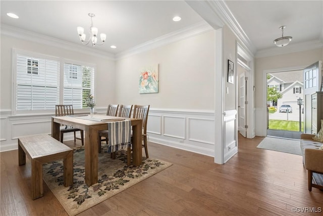 6800 Alabaster Ln, Chesterfield, VA 23234 - dining space with a chandelier, wood finished floors, a wainscoted wall, a decorative wall, and crown molding