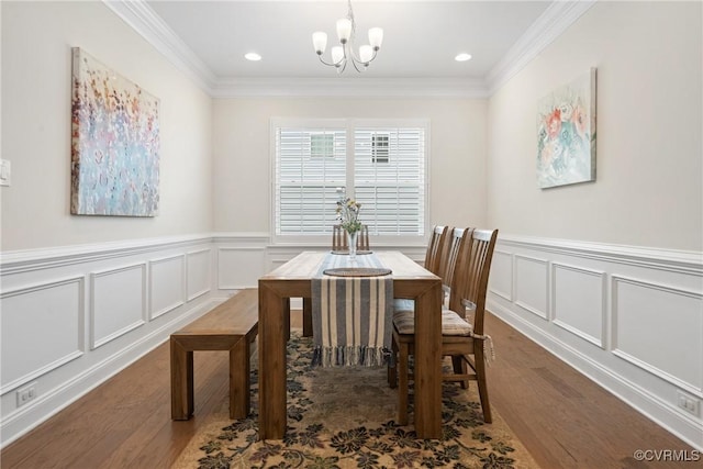 6800 Alabaster Ln, Chesterfield, VA 23234 - dining room featuring a chandelier, wood finished floors, a decorative wall, crown molding, and a wainscoted wall