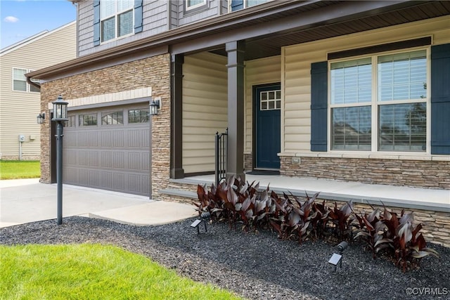 6800 Alabaster Ln, Chesterfield, VA 23234 - doorway to property with stone siding, concrete driveway, an attached garage, and a porch