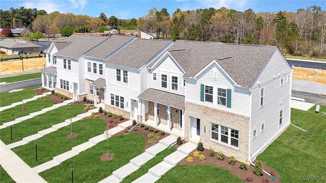 223 Whiteside Rd, Sandston, VA 23150 - traditional-style house featuring stone siding, a shingled roof, and a front yard