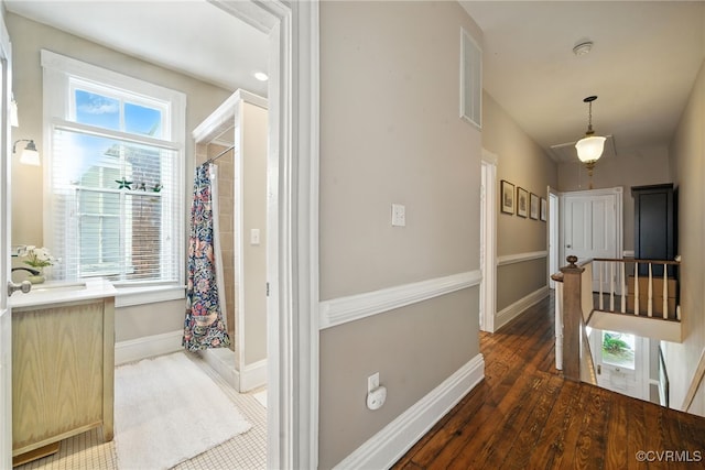 323 N 27th St, Richmond, VA 23223 - hallway featuring an upstairs landing and wood finished floors