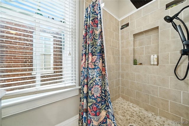 323 N 27th St, Richmond, VA 23223 - bathroom featuring tiled shower and plenty of natural light