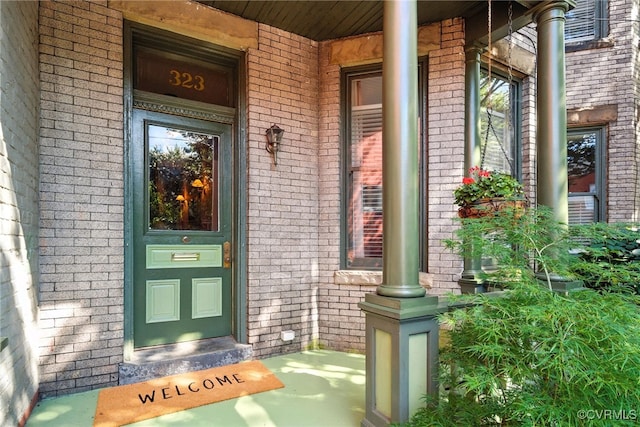 323 N 27th St, Richmond, VA 23223 - property entrance featuring a porch and brick siding