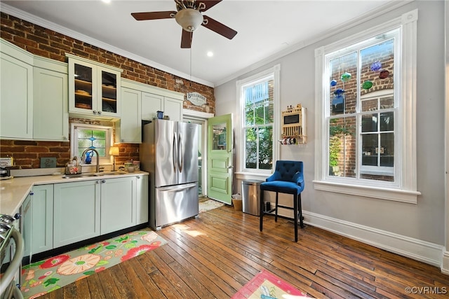 323 N 27th St, Richmond, VA 23223 - kitchen featuring freestanding refrigerator, crown molding, green cabinetry, a ceiling fan, and wood-type flooring