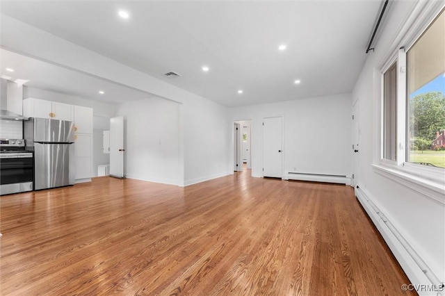 602 Trellis Ln, Henrico, VA 23075 - unfurnished living room with baseboard heating, light wood-style flooring, recessed lighting, and baseboards