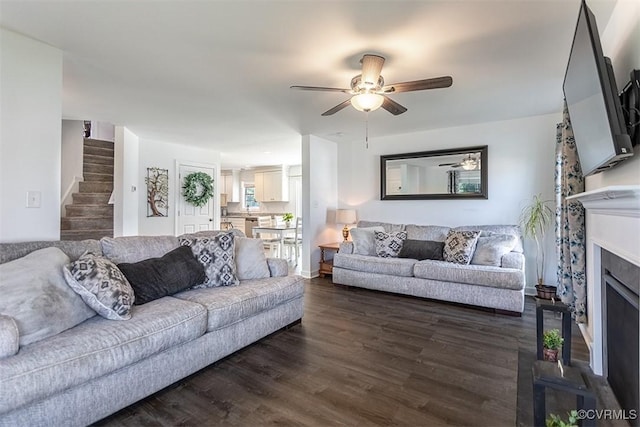 203 Pointers Dr, West Point, VA 23181 - living area featuring a ceiling fan, stairs, dark wood finished floors, and a fireplace