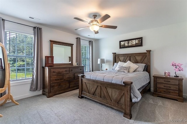 203 Pointers Dr, West Point, VA 23181 - bedroom featuring light carpet, multiple windows, and baseboards