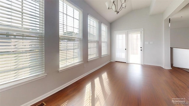 5324 Sandy Ridge Ct, Chesterfield, VA 23832 - empty room with vaulted ceiling, wood finished floors, a chandelier, and baseboards