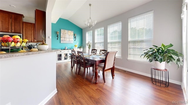 5324 Sandy Ridge Ct, Chesterfield, VA 23832 - dining area with lofted ceiling, wood finished floors, a chandelier, and baseboards
