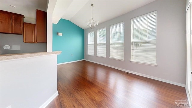 5324 Sandy Ridge Ct, Chesterfield, VA 23832 - unfurnished dining area featuring dark wood finished floors, a chandelier, lofted ceiling, and baseboards
