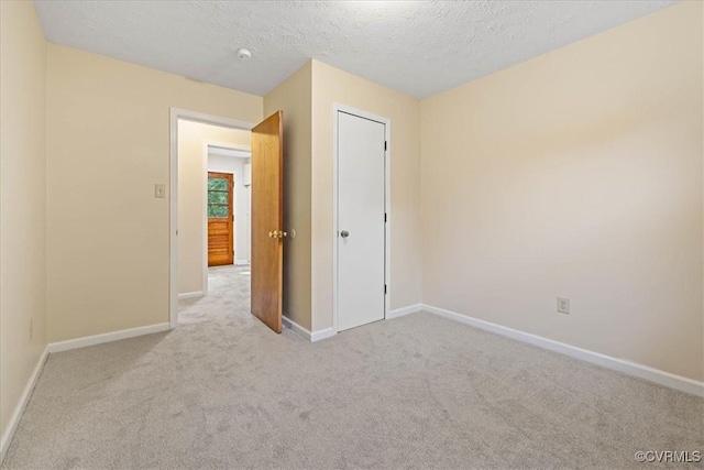 4200 Esposito Pl, Prince George, VA 23875 - empty room with carpet, baseboards, a textured ceiling, and a smoke detector