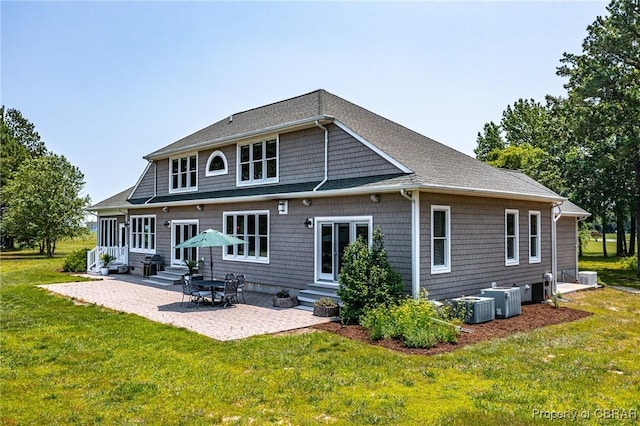 241 Tranquility Rd, Reedville, VA 22539 - rear view of house with entry steps, a yard, a patio area, and central AC unit