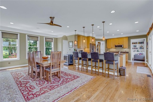 241 Tranquility Rd, Reedville, VA 22539 - dining area with arched walkways, recessed lighting, light wood-style flooring, ceiling fan, and baseboards