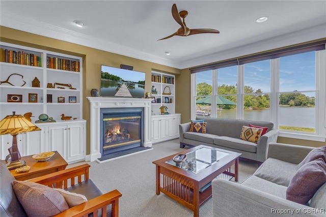 241 Tranquility Rd, Reedville, VA 22539 - carpeted living area with ceiling fan, a glass covered fireplace, ornamental molding, and recessed lighting