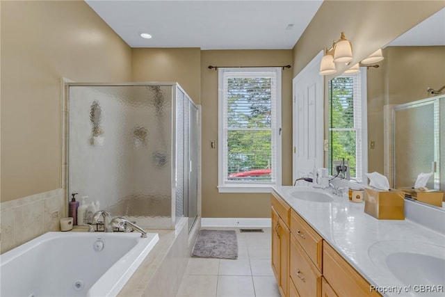 241 Tranquility Rd, Reedville, VA 22539 - full bath featuring a stall shower, a whirlpool tub, double vanity, and tile patterned flooring