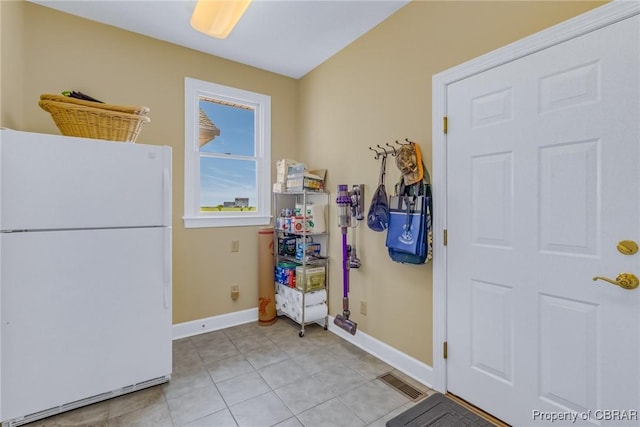 241 Tranquility Rd, Reedville, VA 22539 - entryway with baseboards and light tile patterned floors