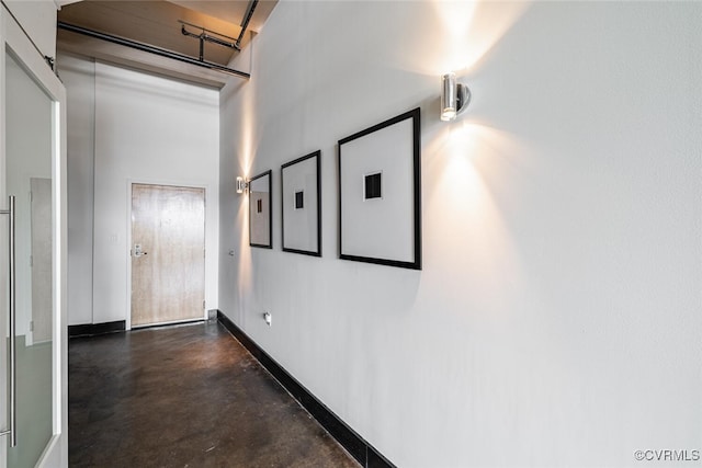 101 W Marshall St Unit U47, Richmond, VA 23220 - hallway with a towering ceiling, finished concrete floors, and baseboards