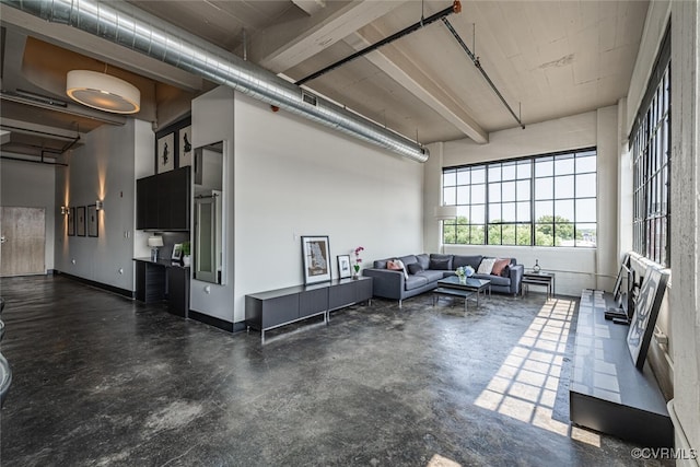 101 W Marshall St Unit U47, Richmond, VA 23220 - living room featuring concrete floors and a towering ceiling