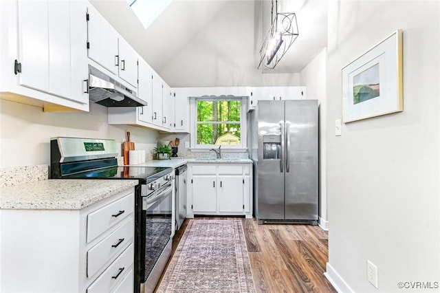 4381 Three Bridge Rd, Powhatan, VA 23139 - kitchen with stainless steel appliances, under cabinet range hood, wood finished floors, a sink, and white cabinets