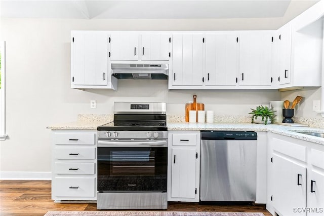 4381 Three Bridge Rd, Powhatan, VA 23139 - kitchen featuring stainless steel appliances, under cabinet range hood, white cabinetry, dark wood-style flooring, and light stone countertops