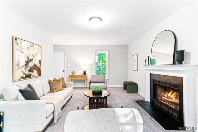 4381 Three Bridge Rd, Powhatan, VA 23139 - carpeted living room featuring a fireplace with flush hearth and baseboards