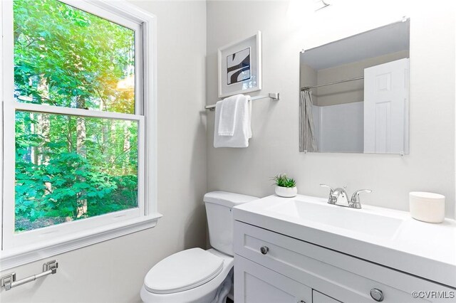 4381 Three Bridge Rd, Powhatan, VA 23139 - bathroom featuring vanity, toilet, and a shower with shower curtain