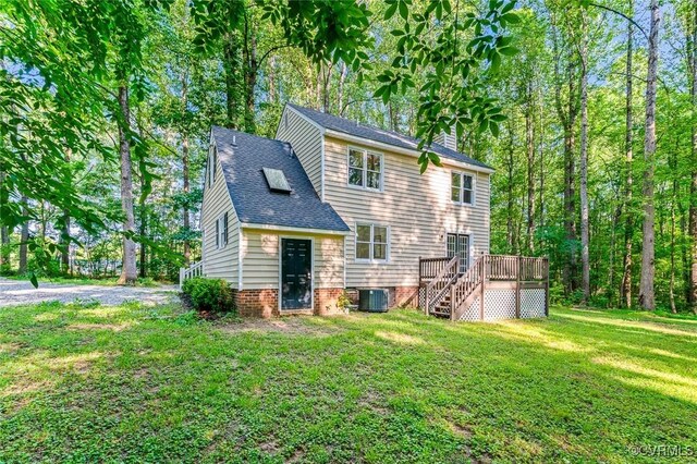 4381 Three Bridge Rd, Powhatan, VA 23139 - back of house featuring central AC, a yard, a wooden deck, a chimney, and stairs
