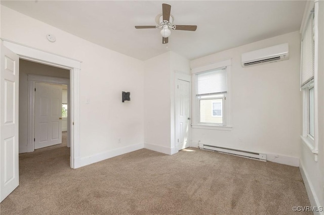 2007 Albany Ave, Richmond, VA 23224 - spare room with a baseboard radiator, a wall mounted AC, carpet floors, and ceiling fan