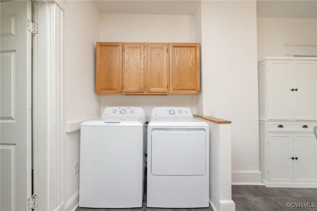 2007 Albany Ave, Richmond, VA 23224 - laundry room with washer and clothes dryer, cabinet space, and baseboards