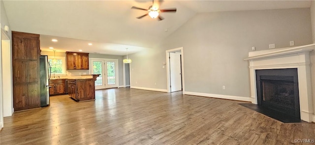379 Moncuin Ct, Manquin, VA 23106 - unfurnished living room featuring ceiling fan, a fireplace with flush hearth, wood finished floors, recessed lighting, and high vaulted ceiling