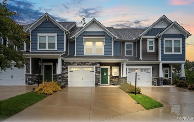 18304 Palisades Ct, Moseley, VA 23120 - craftsman-style home with an attached garage, a porch, driveway, and stone siding