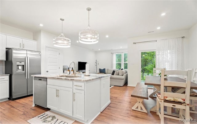 18304 Palisades Ct, Moseley, VA 23120 - kitchen featuring appliances with stainless steel finishes, light wood finished floors, white cabinetry, light stone countertops, and recessed lighting