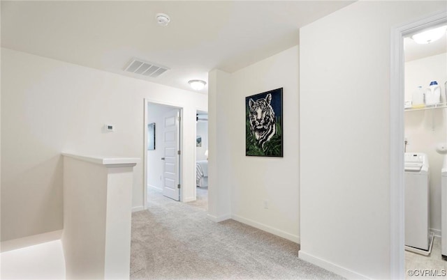 18304 Palisades Ct, Moseley, VA 23120 - hallway with separate washer and dryer, light colored carpet, and an upstairs landing