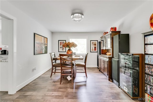15606 Corte Castle Ter, Chesterfield, VA 23838 - dining area with light wood-style flooring, baseboards, and a chandelier