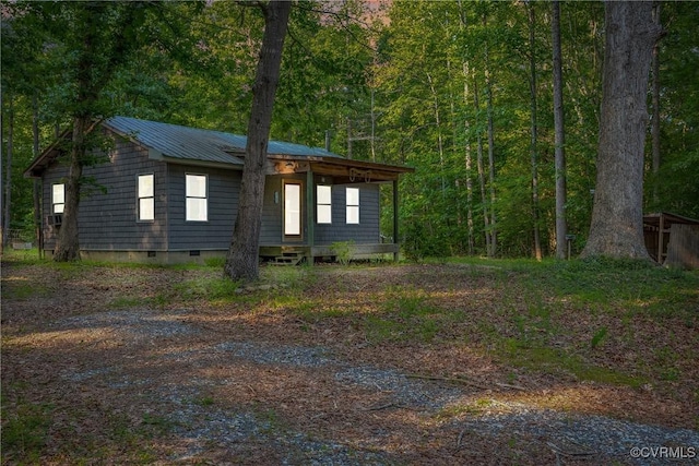 3966 Holts Ln, Saluda, VA 23149 - view of side of home with crawl space, a forest view, and metal roof