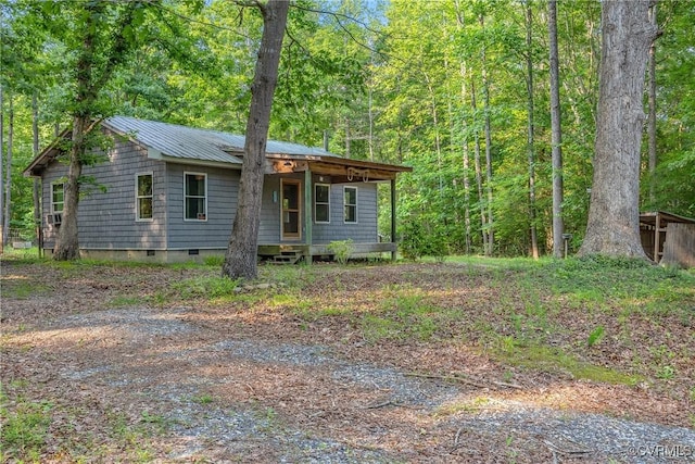 3966 Holts Ln, Saluda, VA 23149 - view of front of house with crawl space, a view of trees, and metal roof