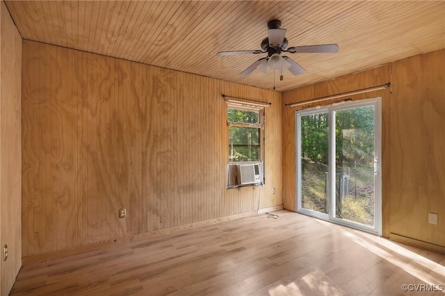 3966 Holts Ln, Saluda, VA 23149 - unfurnished room with plenty of natural light, wood finished floors, wood walls, and a ceiling fan