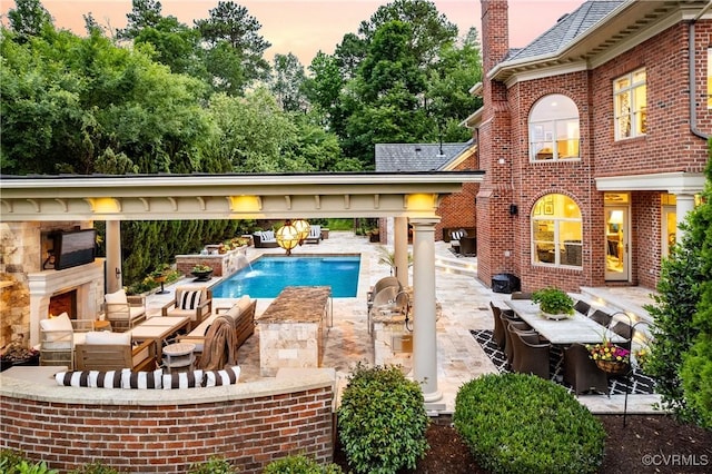 11905 Lerade Ct, Glen Allen, VA 23059 - outdoor pool featuring an outdoor living space with a fireplace and a patio area