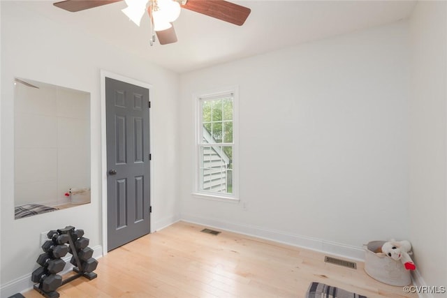 7313 Key Deer Cir, Midlothian, VA 23112 - empty room with wood finished floors, ceiling fan, and baseboards